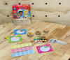 the Orchard First Times Tables pieces and box displayed on wooden table
