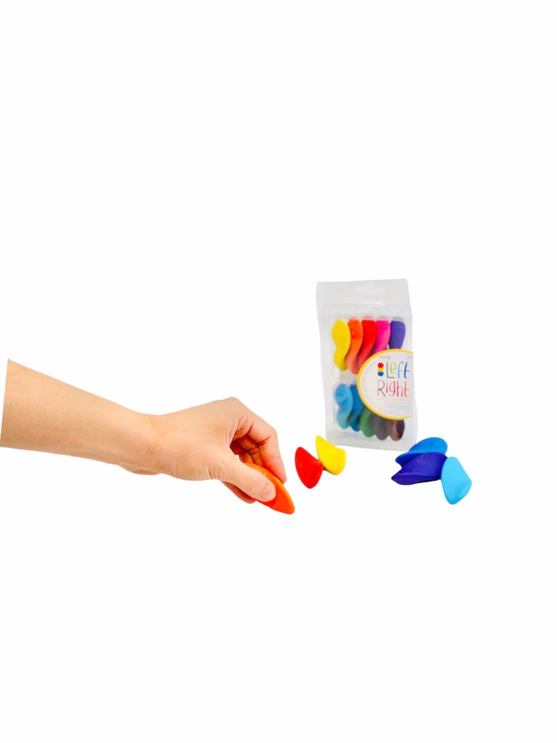 a person holding the orange crayon from the Left Right Ergonomic Crayons