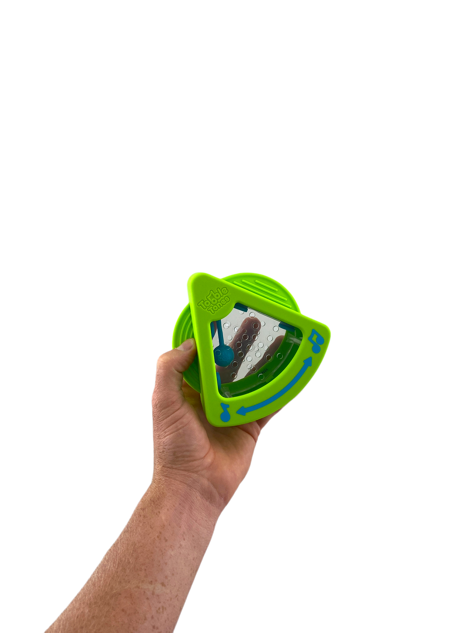 a hand holding the green Fat Brain Tobble Tones