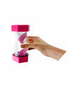 Hand holding giant pink 2 minute sand timer on white background