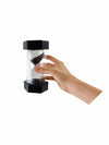 hand holding up the giant black 30 Minute Sand Timer