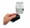 a hand holding the Annabel Trends Scalp Massager - Black in fornt of white box