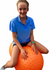 Girl wearing blue t-shirt sitting on inflated CanDo Sensi-Saddle Roll - Orange/medium with white background