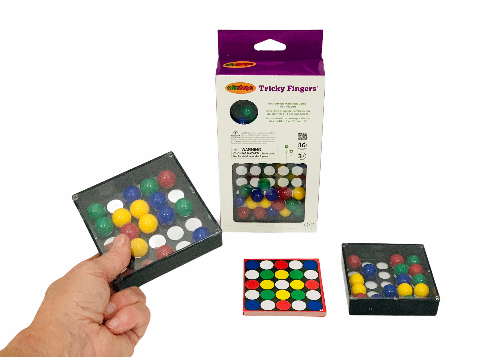 EduShape Tricky Fingers Game with hand holding one of the game boxes and pattern cards laid out on white background