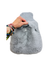 a hand touching the grey Weighted Plush Luxe Pad - 3kg