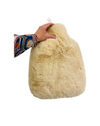 a hand touching the caramel Weighted Plush Luxe Pad - 3kg