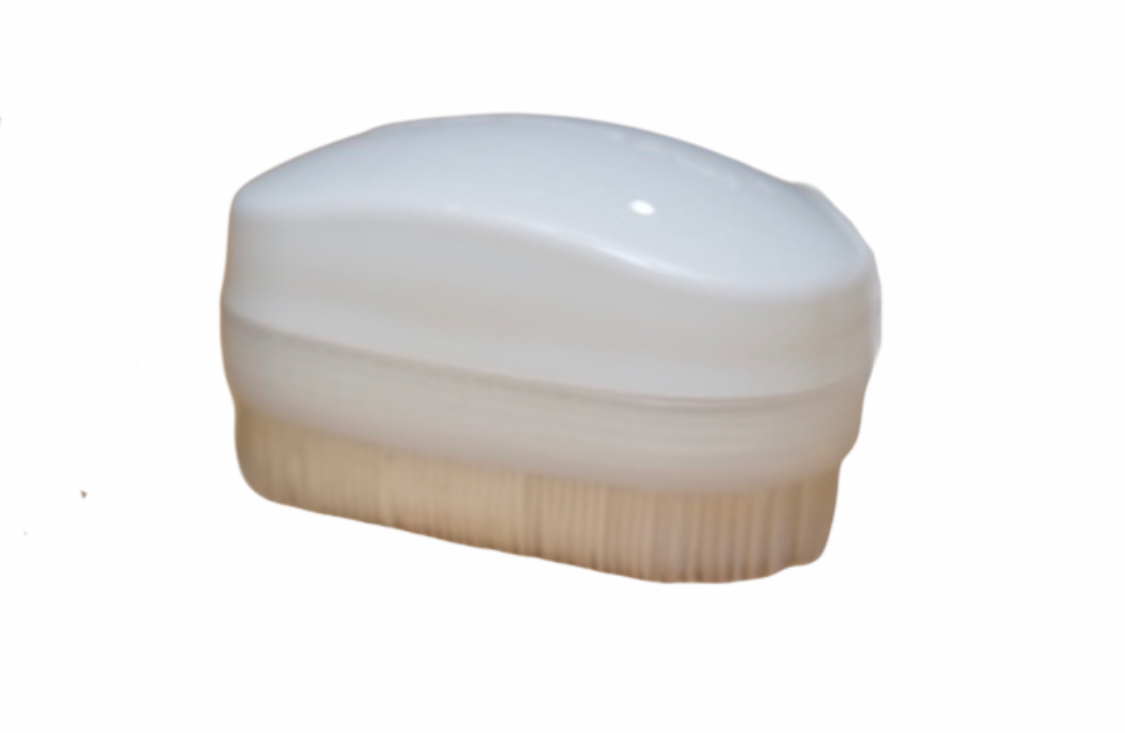 Wilbarger Therapy Brush in white on white background