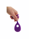 a hand holding the purple Chewy Charms Necklace Chew - Teardrop on a white bakcgorund